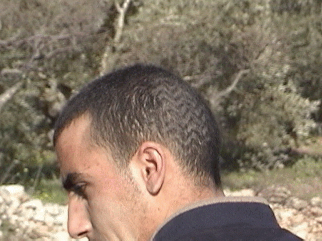 Photo of Palestinians man with a footprint on his head.